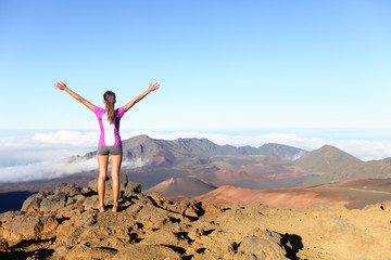 Hiking woman on top happy and celebrating success