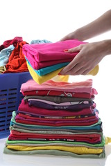 Female folds laundry