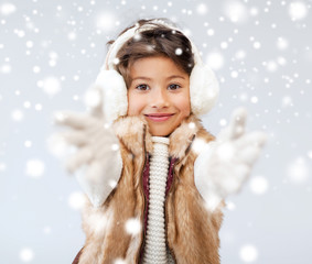 Wall Mural - happy littl girl in winter clothes