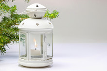 White Lantern And Fir Branches On White Background