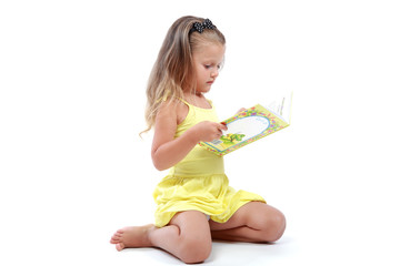 cute little girl with an open book.
