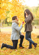 © Syda Productions - man proposing to a woman in the autumn park