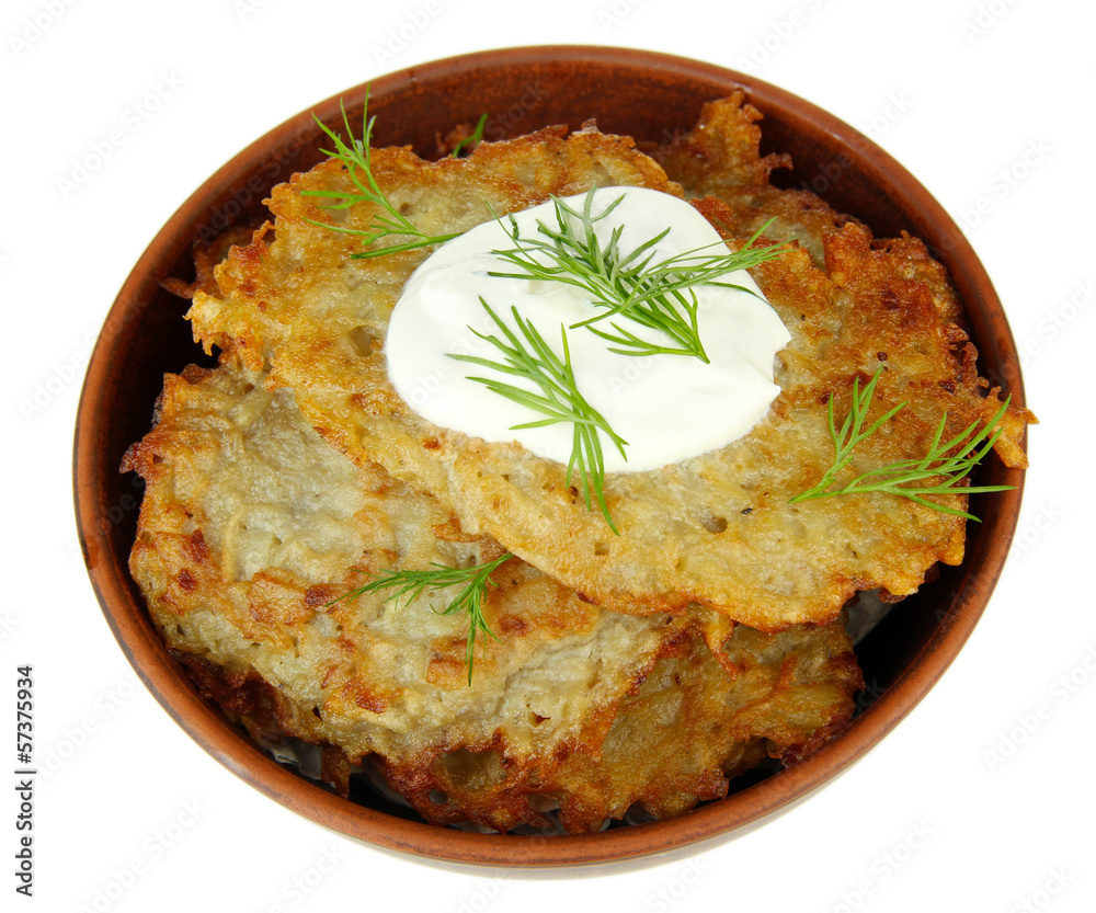 Potato pancakes in bowl, isolated on white