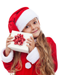 Wall Mural - Happy little christmas girl with present