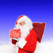canvas print picture - Weihnachtsmann mit rotem Geschenk
