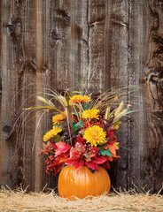 Wall Mural - Pumpkin flower arrangement on hay
