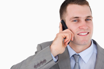 Wall Mural - Close up of businessman looking up while on the cellphone