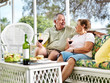 © Joshua Resnick - senior couple outside on patio relaxing