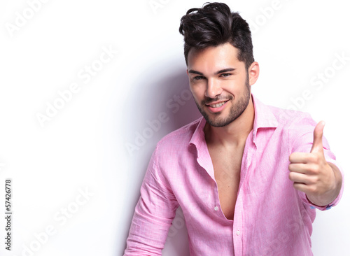 Fototapeta do kuchni young fashion man shows thumb up