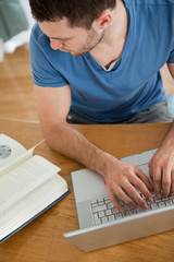 Poster - Student copying something from his book