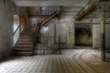 Wall Mural - Old stairs in an abandoned hall