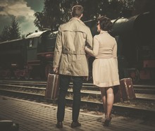 Beautiful Vintage Style Couple With Suitcases 