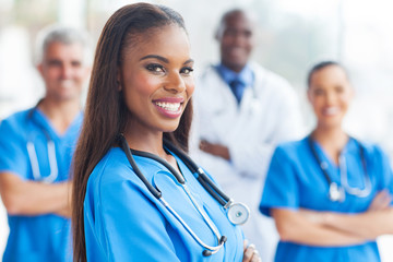 Wall Mural - african female nurse with colleagues