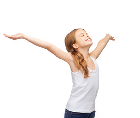 smiling teenage girl with raised hands