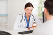 © WavebreakMediaMicro - Female doctor and patient with pills