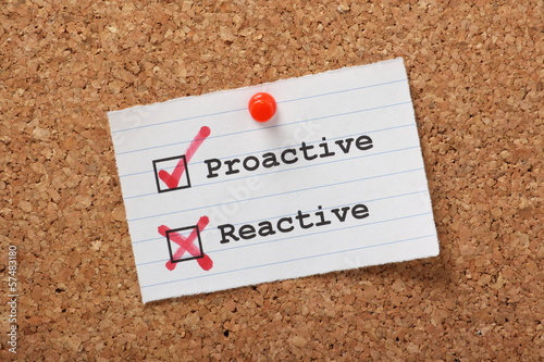 Fotografie, Obraz Proactive versus Reactive on a cork notice board