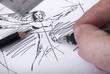Person sketching vitruvian man