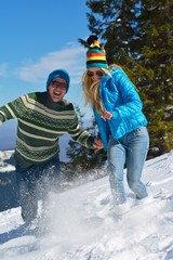 Wall Mural - Young Couple In Winter  Snow Scene