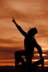 Wall Mural - cowboy kneel silhouette point up