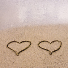 Symbols Of Two Hearts Drawn On Sand, Love Concept