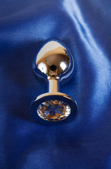 Sticker - Metal butt plug on blue satin