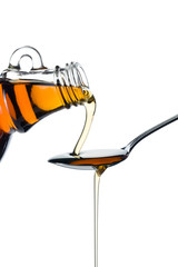maple syrup pourin on spoon