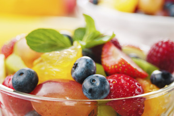 Wall Mural - Sweet tasty fruit salad in the bowl