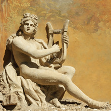 Sculpture Of Ancient God With The Lire Instrument