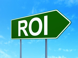 Finance concept: ROI on road sign background