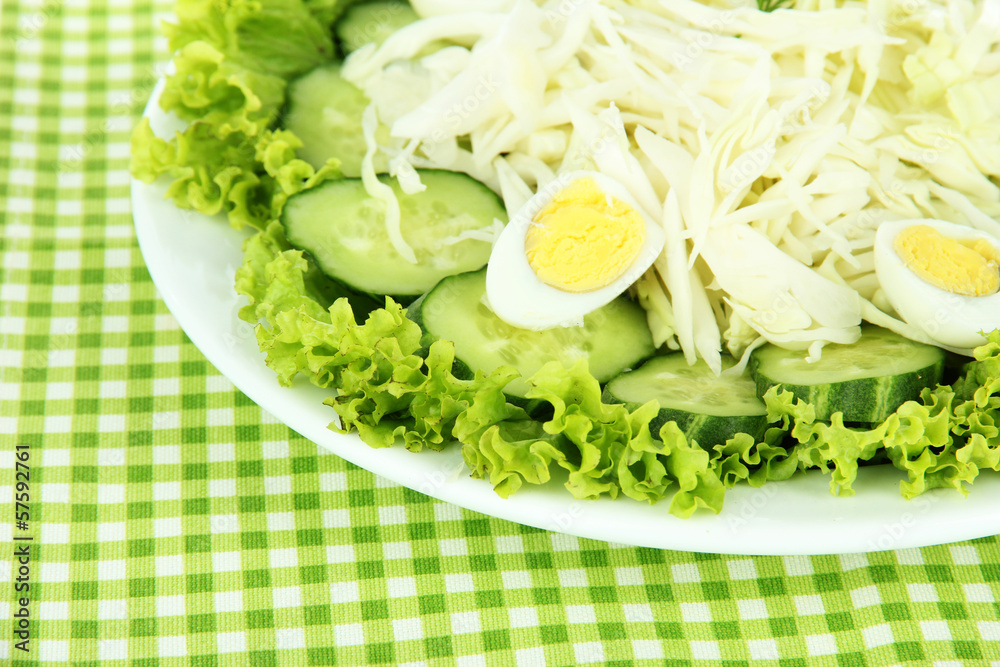 Delicious salad with eggs, cabbage and cucumbers