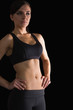 © WavebreakmediaMicro - Beautiful sporty woman posing in sportswear with her hands on hi