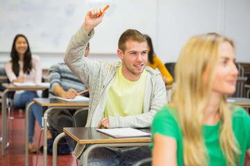 Poster - Male student raising hand by others in classroom