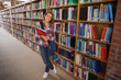 © WavebreakmediaMicro - Pretty smiling student holding notebooks
