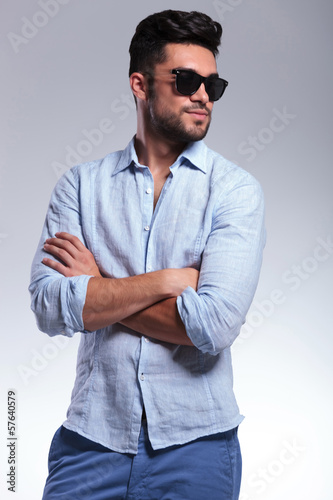 Fototapeta do kuchni casual man with crossed hands looks away