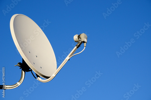 Fotografie, Tablou Satellite TV antenna on blue sky background