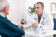 © luckybusiness - Senior man at doctor