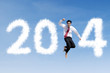 © Creativa Images - Happy businessman jumps with clouds of 2014