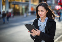 Asian Woman In New York City Using Ipad Tablet Pc