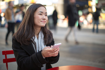 Sticker - Asian woman in New York City texting cellphone