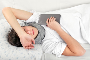 Wall Mural - Sick Teenager with Tablet