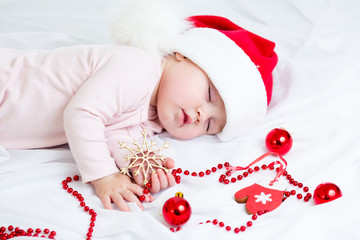 Fototapete - sleeping baby girl Santa Claus