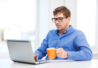 man working with laptop at home