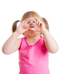 funny kid girl drinking water from glass