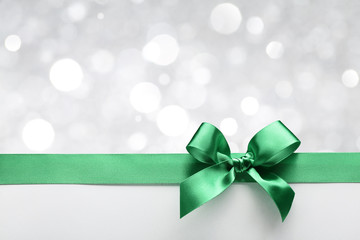 Canvas Print - Green ribbon bow with bokeh