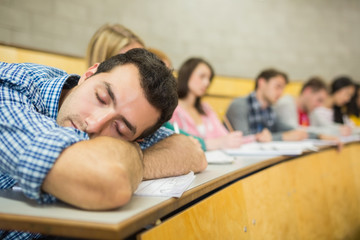 Poster - Male sleeping with students in lecture hall