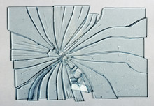 Broken Glass On A Gray Background