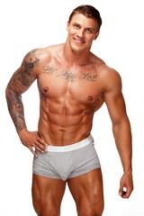 Man with beautiful muscular tattooed torso in underwear