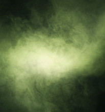 Abstract Texture Of The Green Smoke Over Black Background