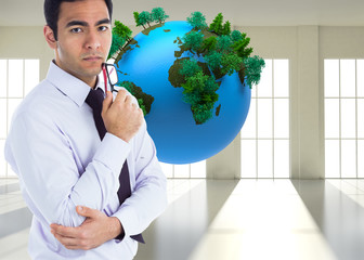 Poster - Composite image of unsmiling businessman holding glasses