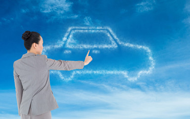 Poster - Composite image of unsmiling asian businesswoman pointing